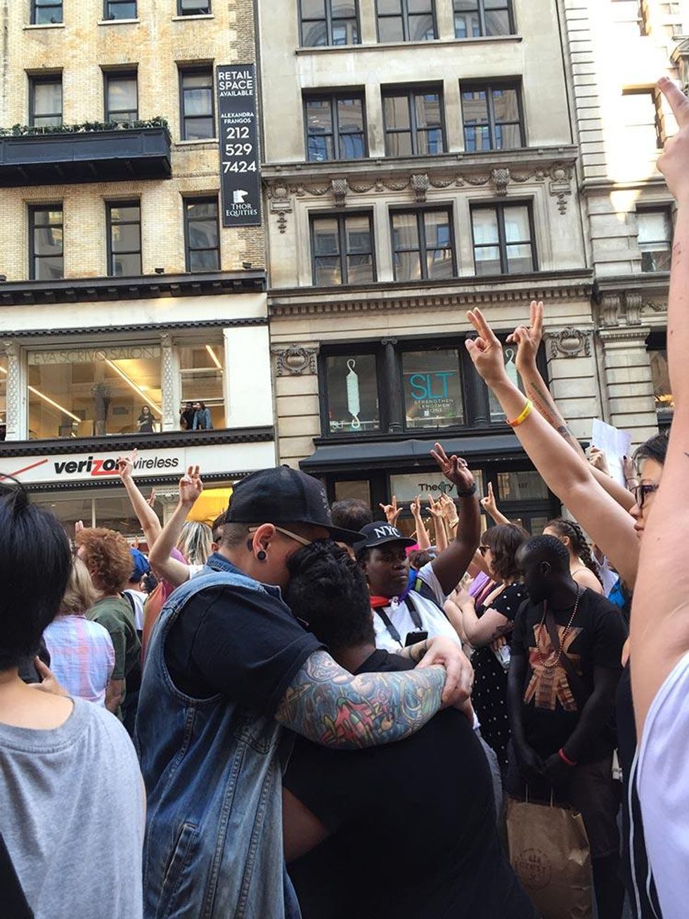 Loved ones hold each other during a moment of silence for the Pulse nightclub shooting victims.