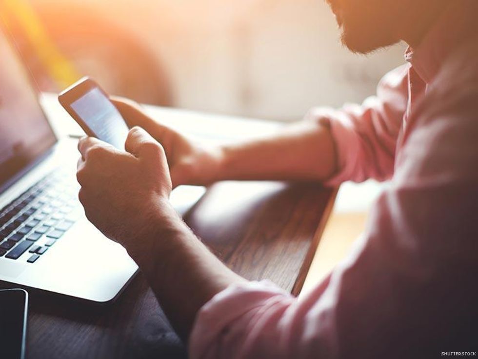 man at work checking cell phone