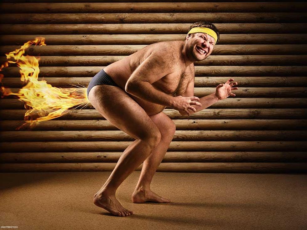 man blasting fire fart