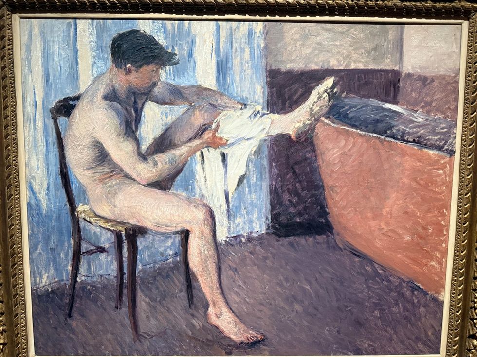 MAN DRYING HIS LEG 1884