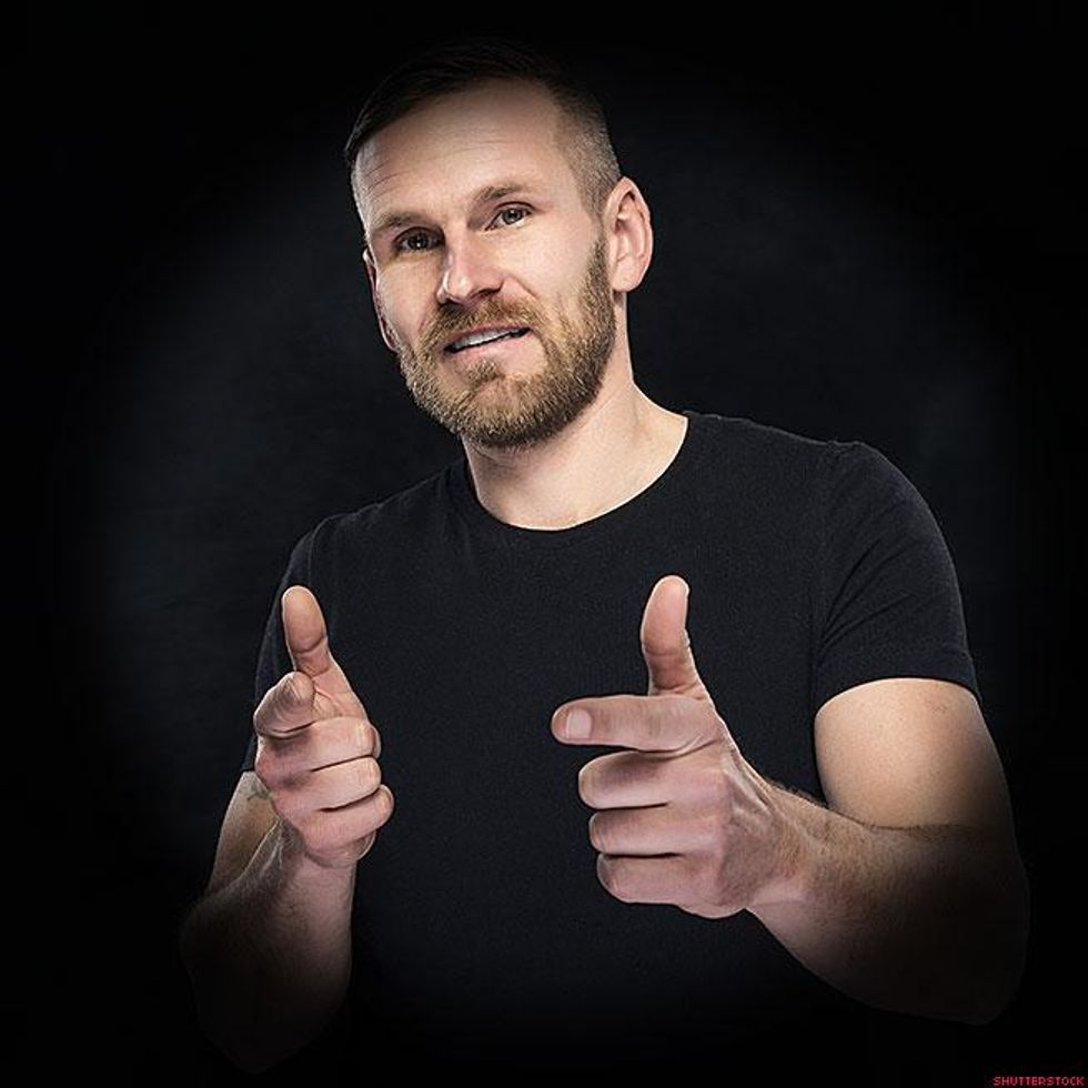 man giving finger guns