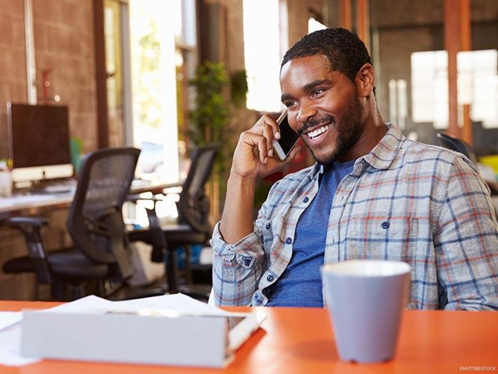 man in coffee shop on cell phone