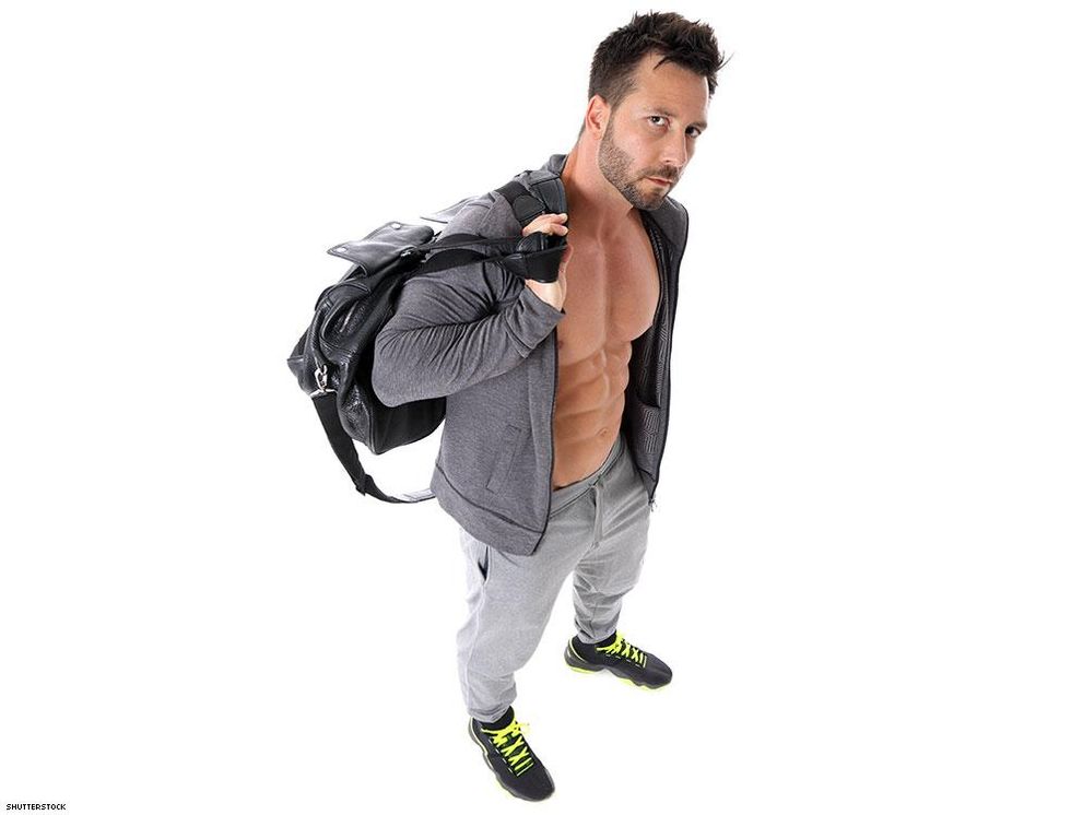 man in gym clothes with a backpack