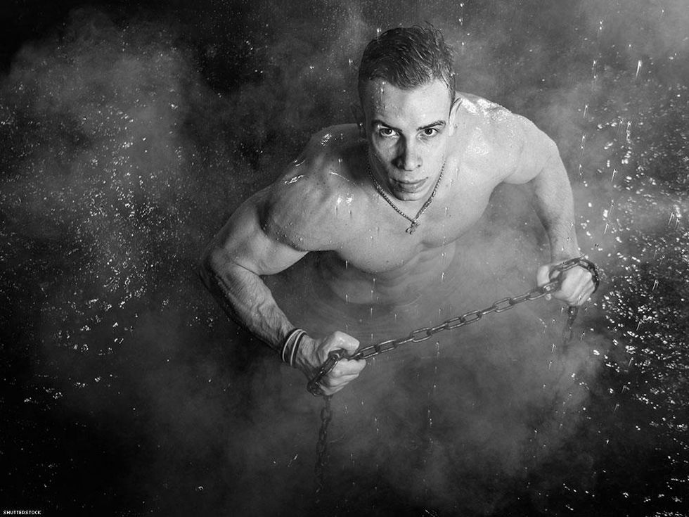 man in the rain holding chains