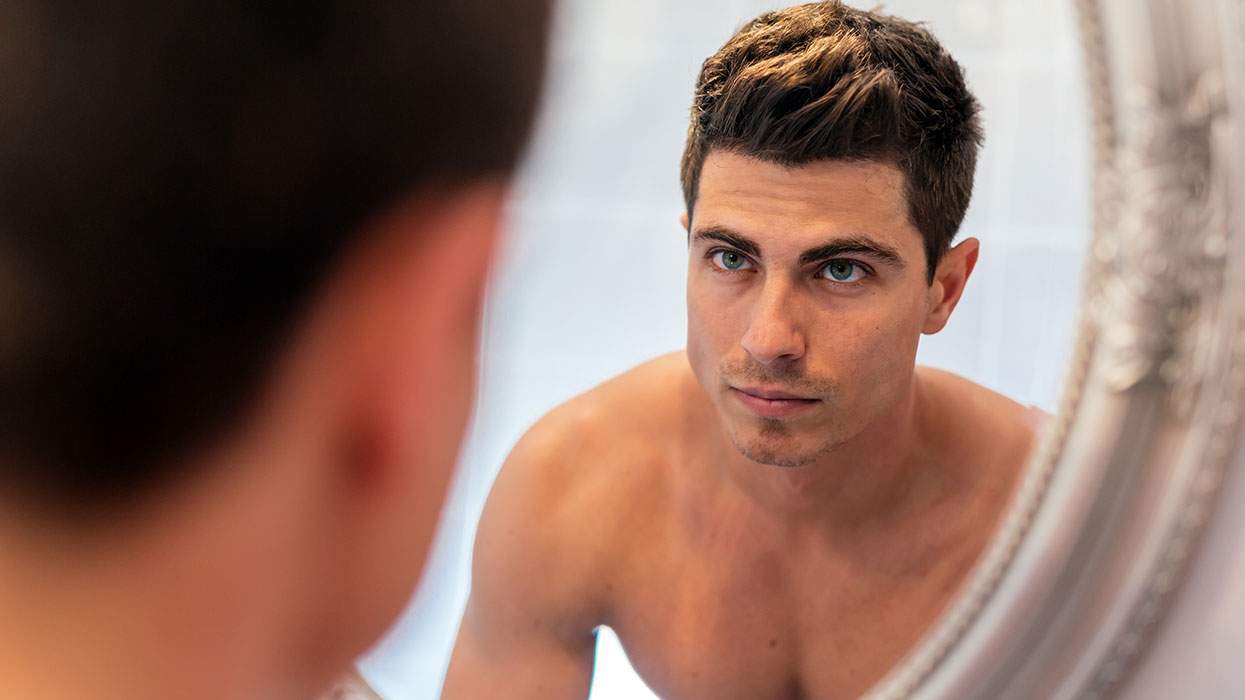 man looking in mirror