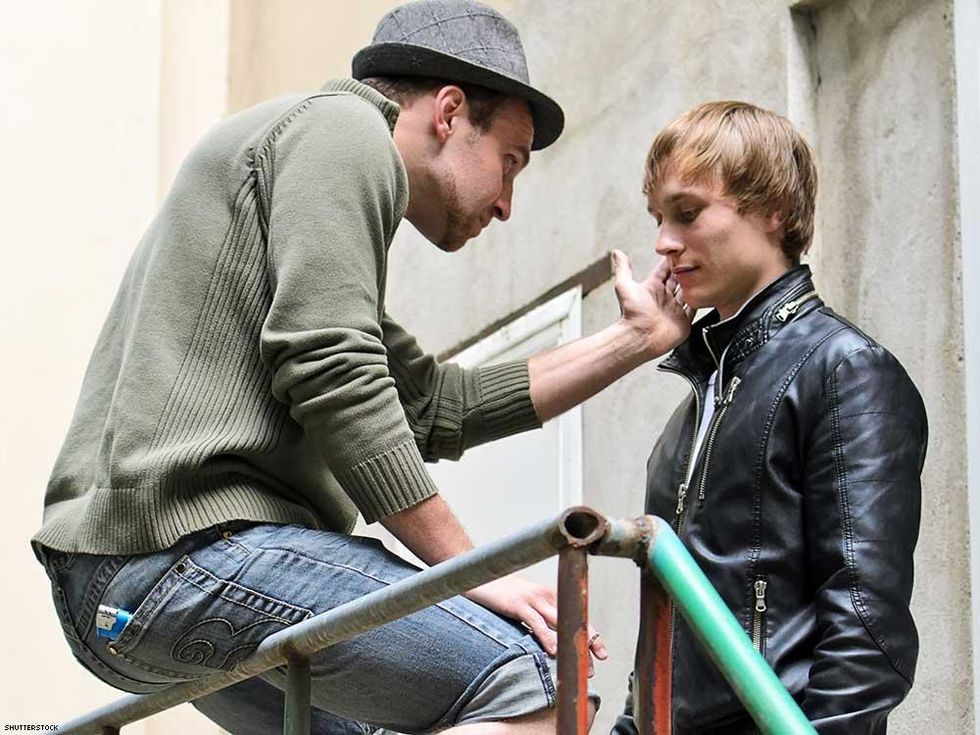 man scolding another man