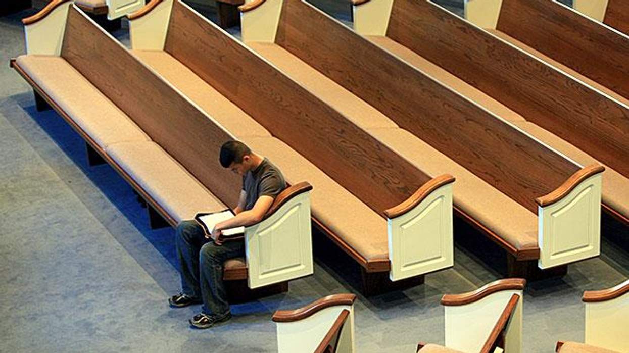 Man sits alone in empty church