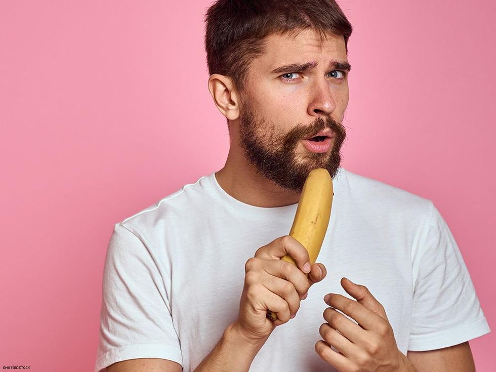 man thinking about eating a banana