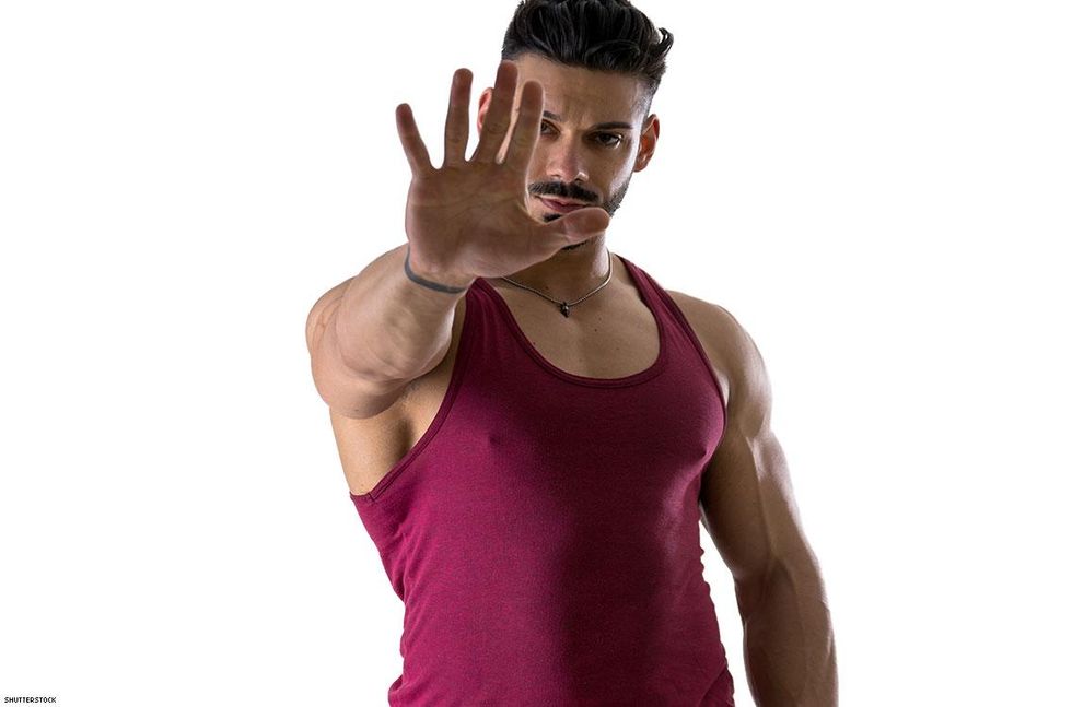 man with hand out stop gesture