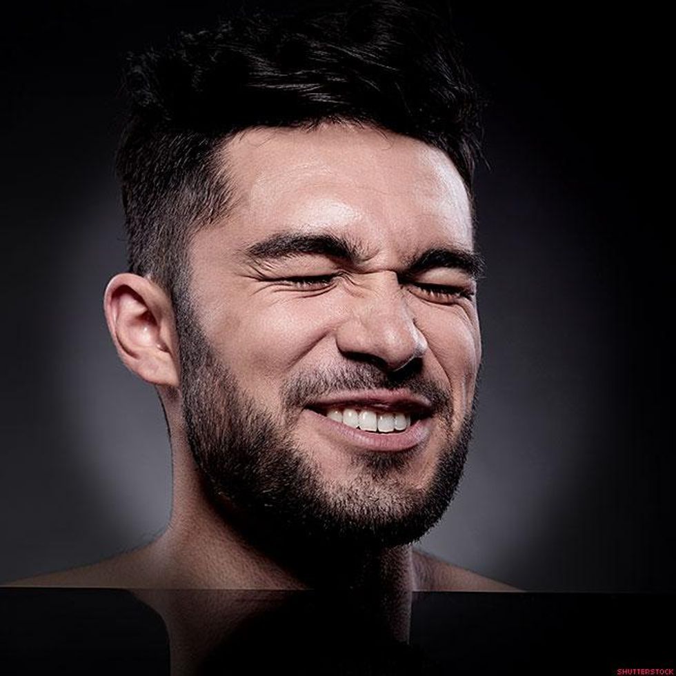 man with scrunched face