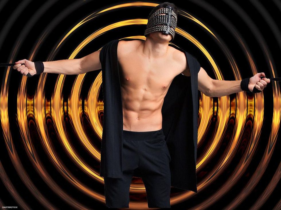 man with wrist cuffs and a face mask chest exposed and rippled background