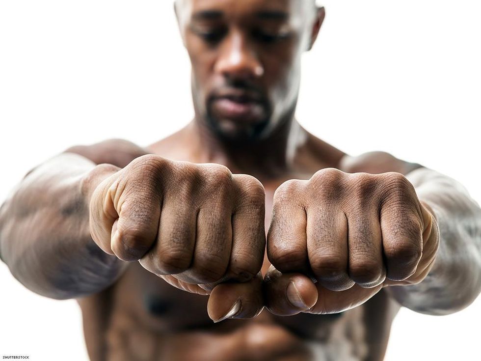 mans knuckles toward the camera