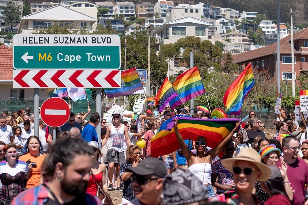 March 2019 participants amidst rainbow flags at the LGBTQ Pride Parade event in Cape Town South Africa