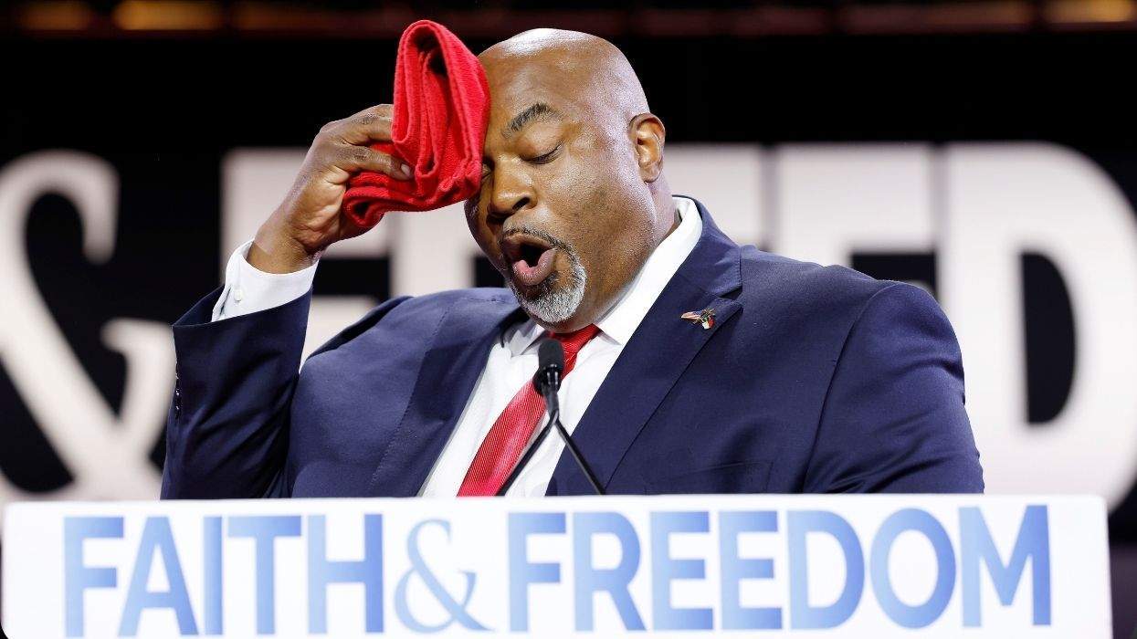 mark robinson wiping his forehead during a speech at the faith and freedom conference