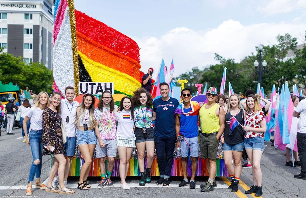 Matt Easton (center in navy shirt) a political science valedictorian at Brigham Young University, came out as gay during his graduation speech this April.