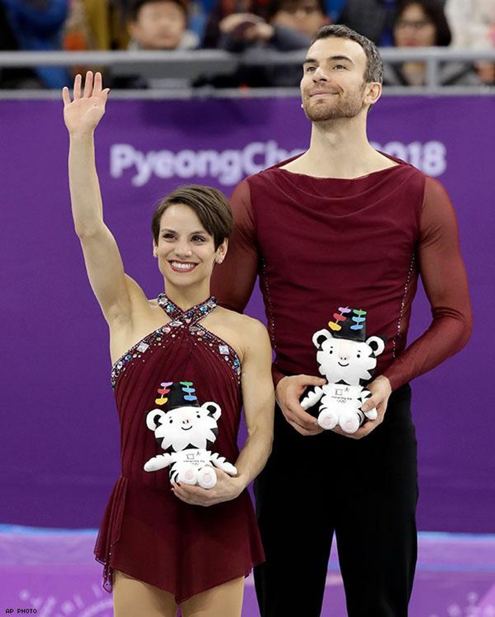 Meagan Duhamel and Eric Radford of Canada celebrate after taking the bronze medal in the pairs free skate figure skating final in the Gangneung Ice Arena