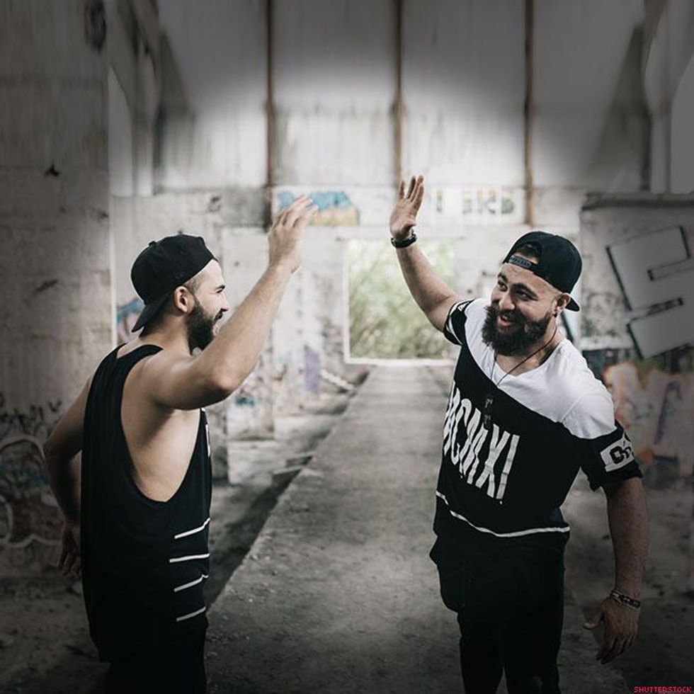 men giving high five