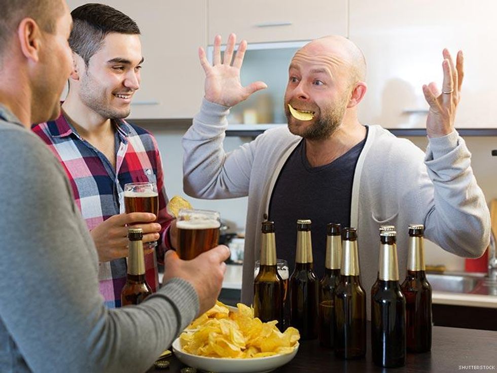 men sharing beer and chips during party night