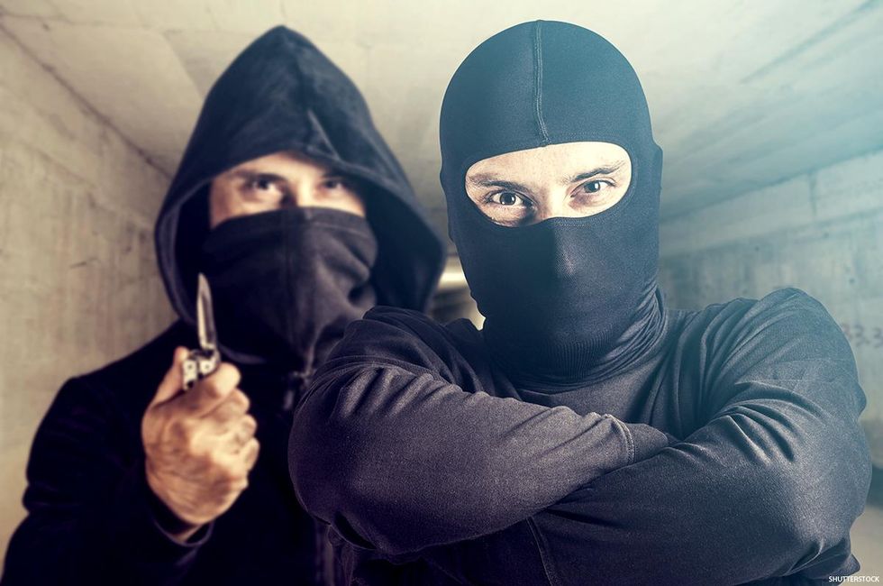 Menacing criminals in masks.