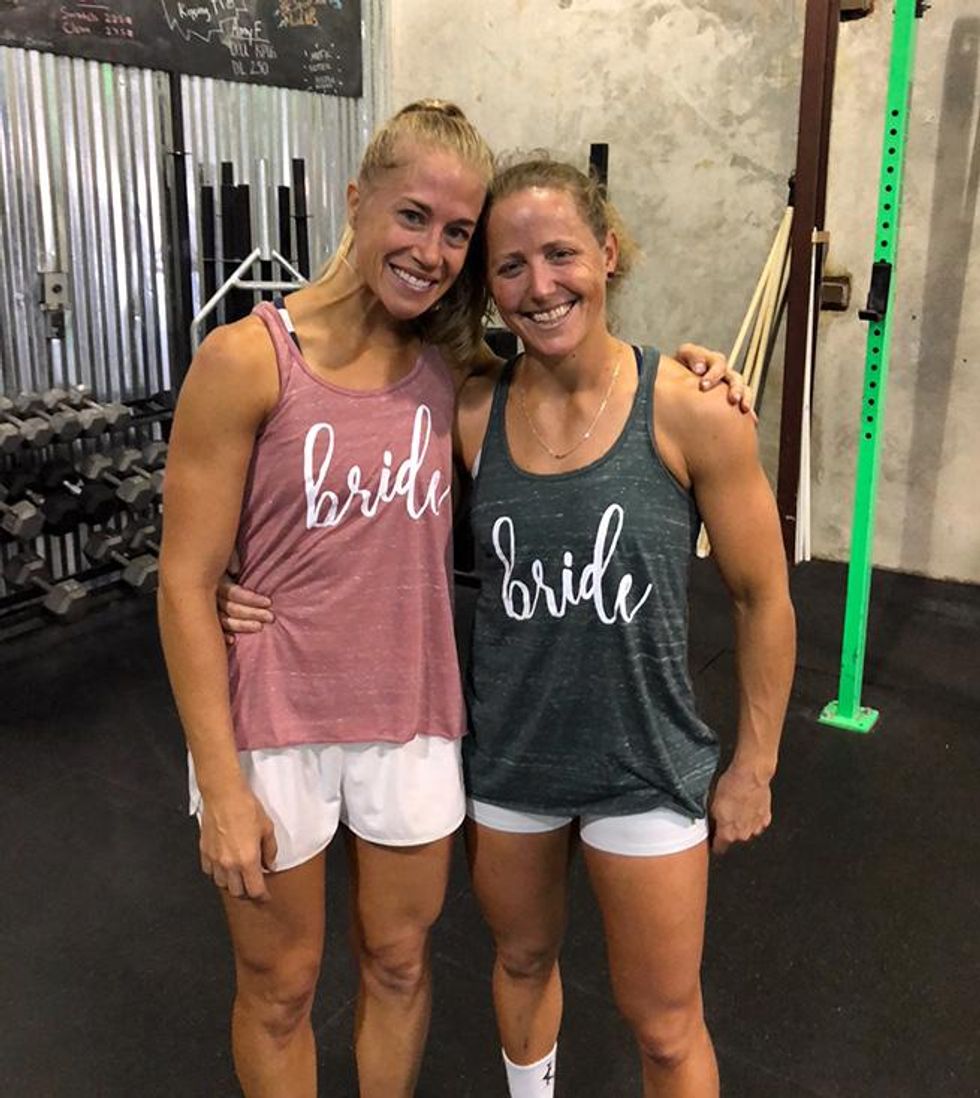 Michelle Kinney (right) \u2014 2014\u2019s 12th Fittest Woman in the World \u2014 with her wife Lauren Hinrichs (left) during their \u2018wedding day workout\u2019 in 2018