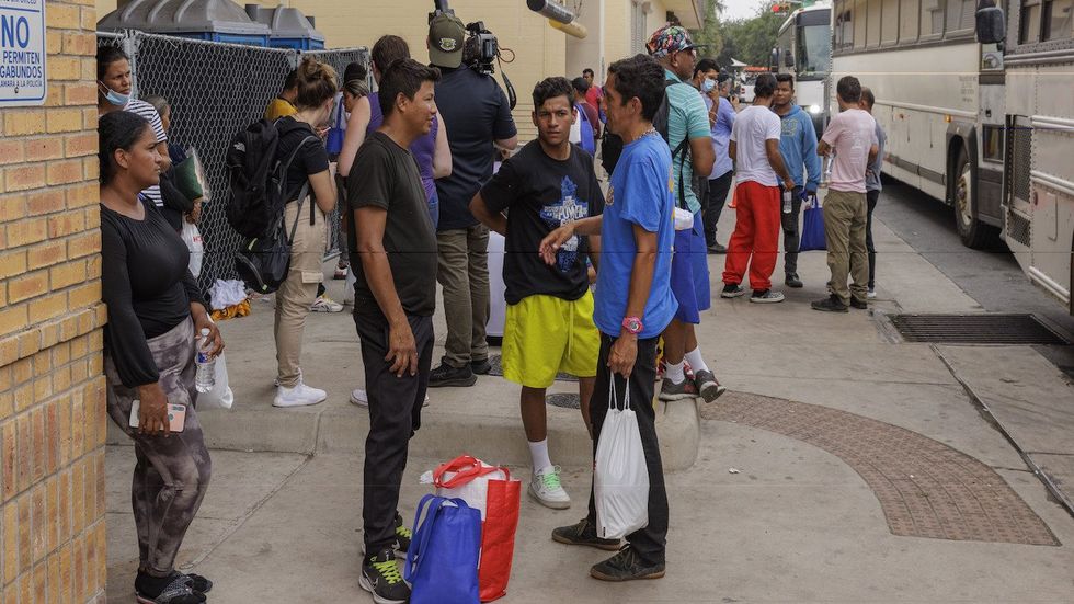 Migrants at a border crossing station in Brownsville, Texas