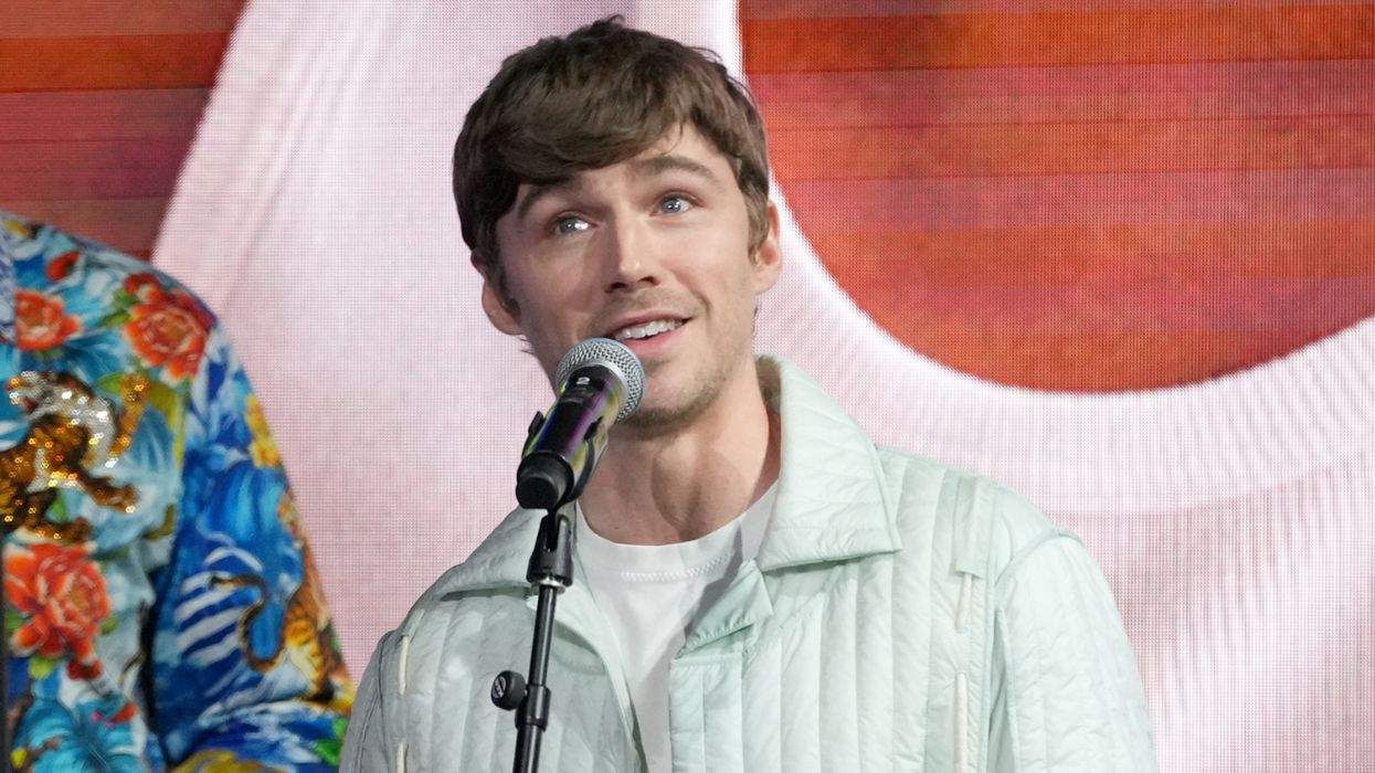 Miles Heizer on stage at the 2025 Out100 Celebration