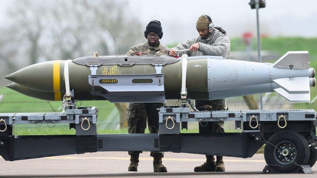 military members moving two bombs