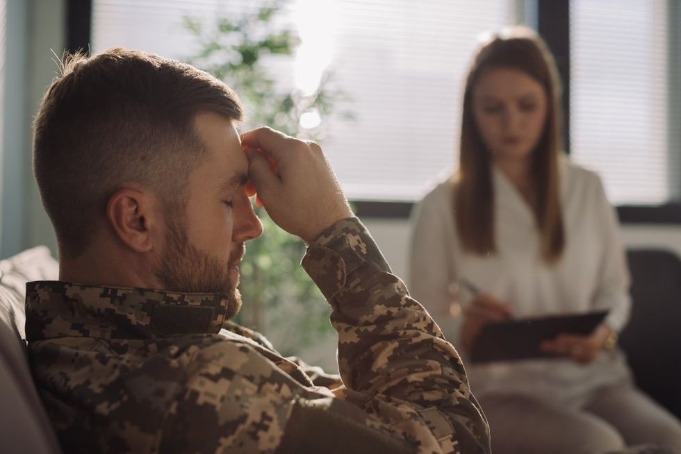 Military officer in doctors appointment