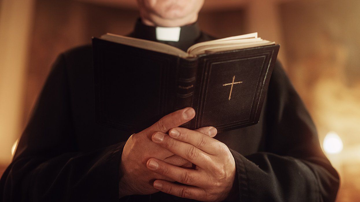 Minister Leads The Congregation In Prayer and Reads From The Bible