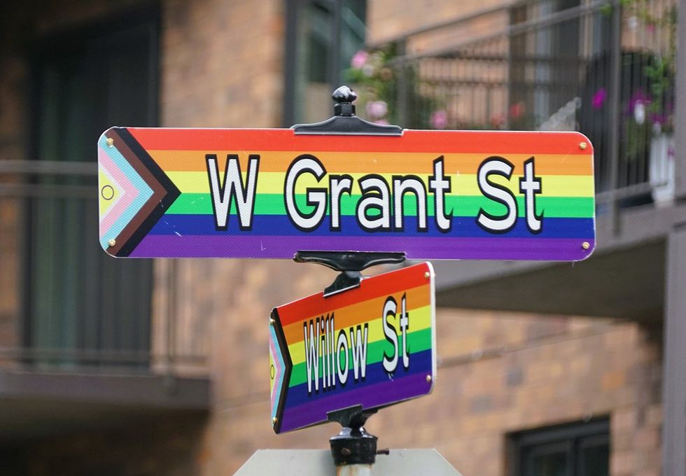 Minneapolis Minnesota 2024 LGBTQIA rainbow flag street signs for West Grant Street and Willow Street