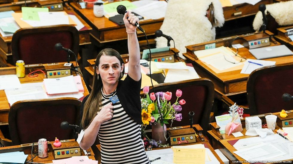 Montana state Rep. Zooey Zephyr raising her silenced microphone to allow the crowd in the gallery to be symbolically heard