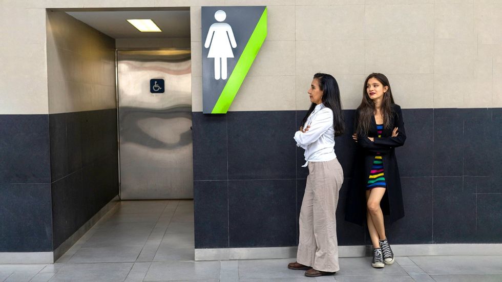 Mother Transgender Daughter waiting public gendered bathroom