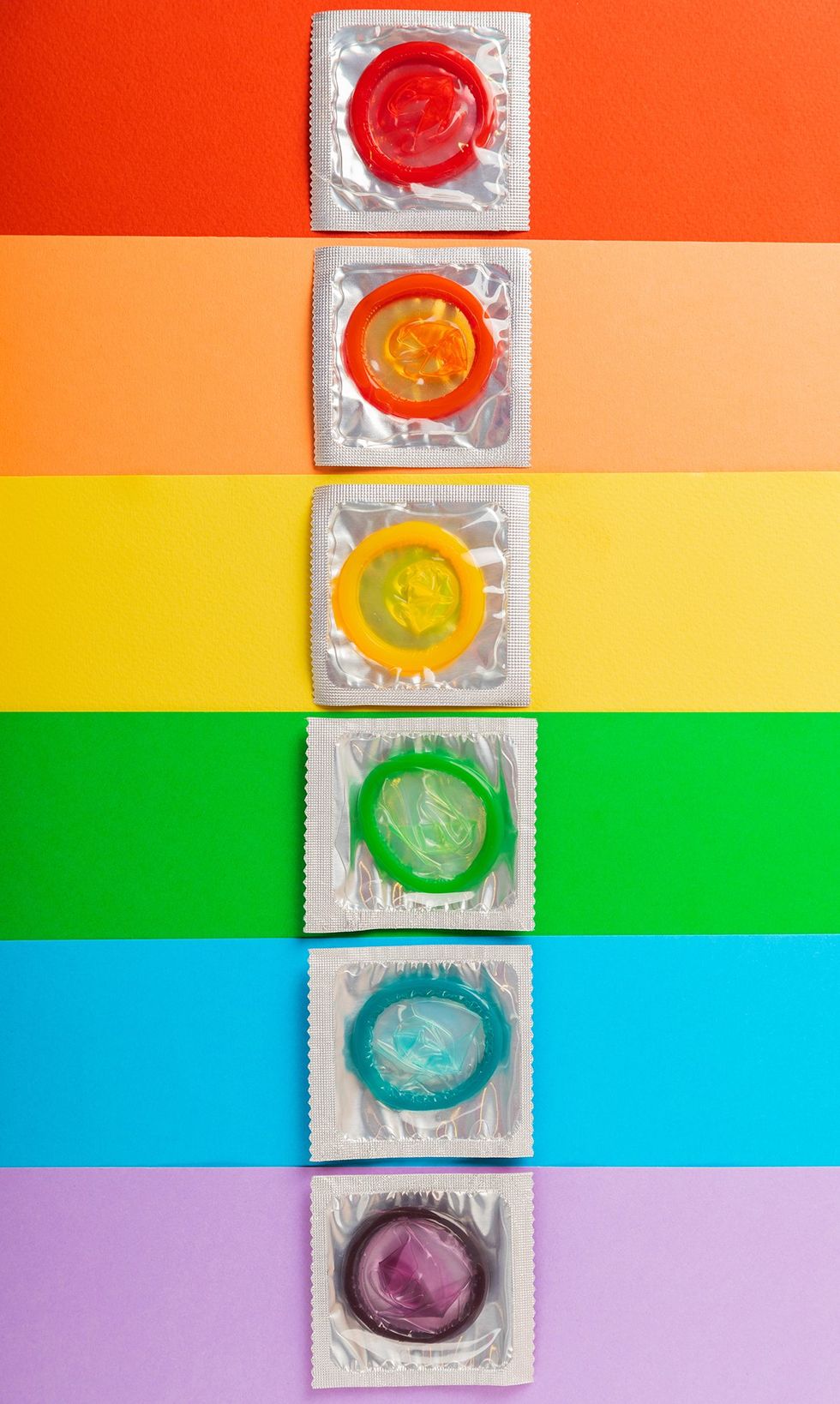 multicolor rainbow of condoms in individual wrappers