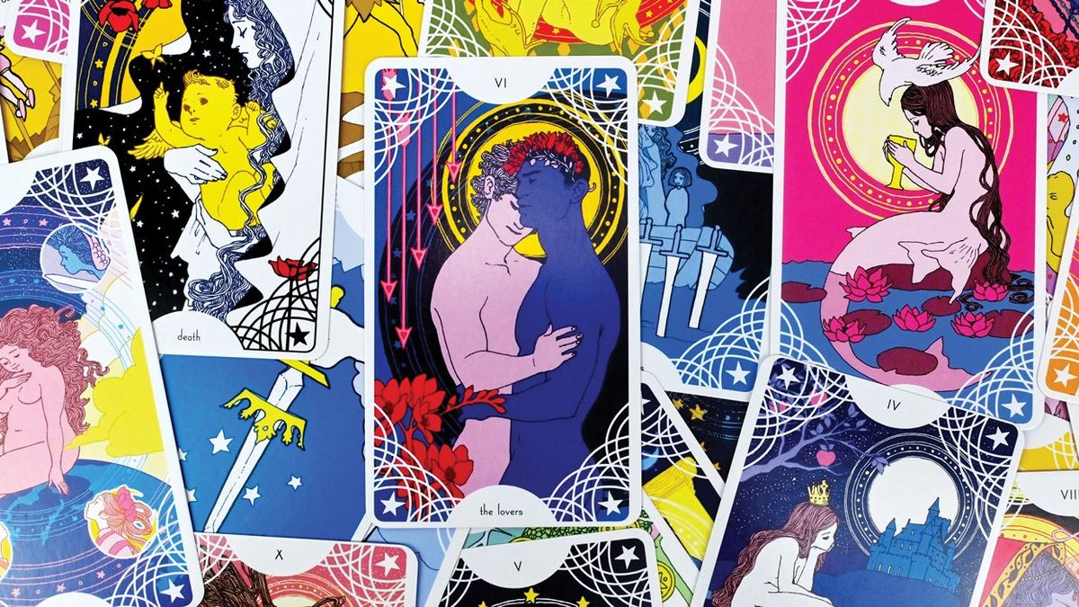 multiple tarot cards with a male couple pictured on the center card