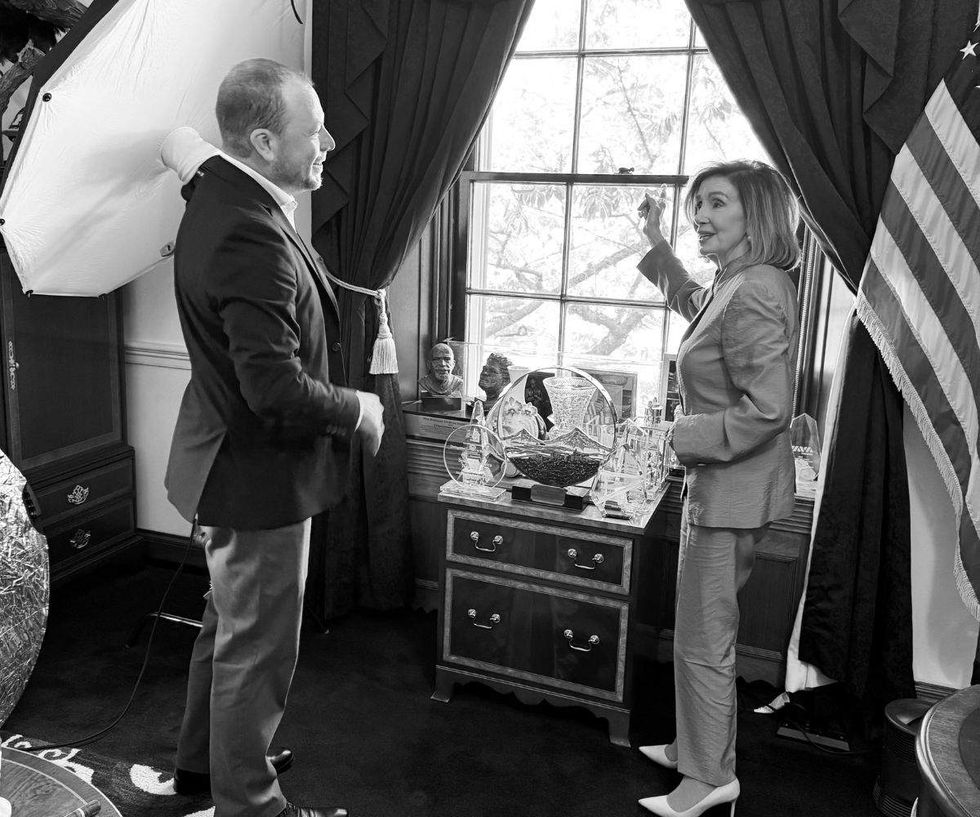 nancy pelosi explains her view to photographer mike nelson