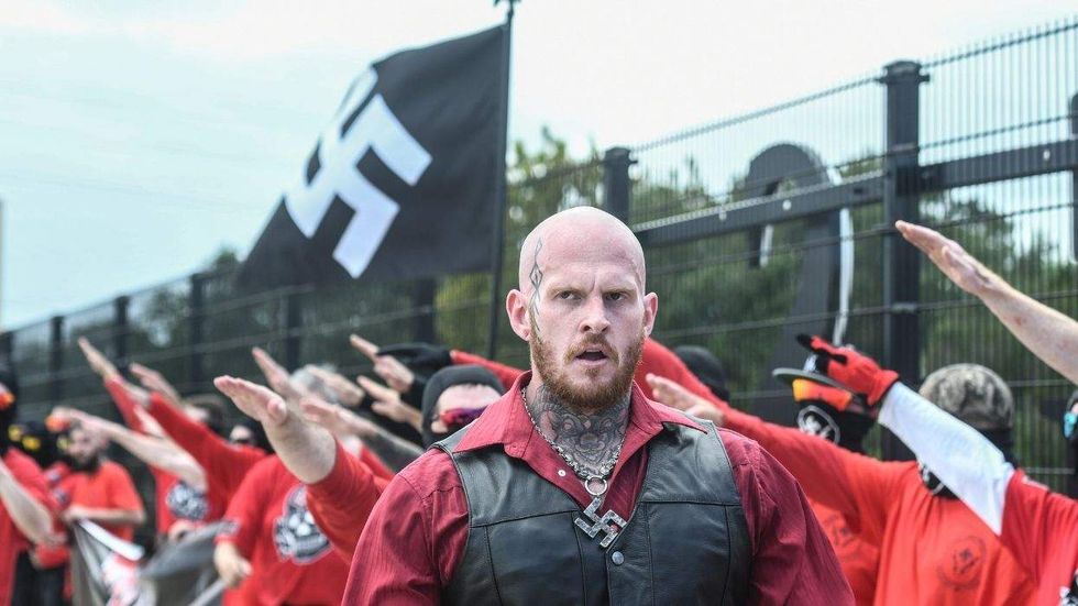 Swastika-waving neo-Nazi group disrupts Georgia LG