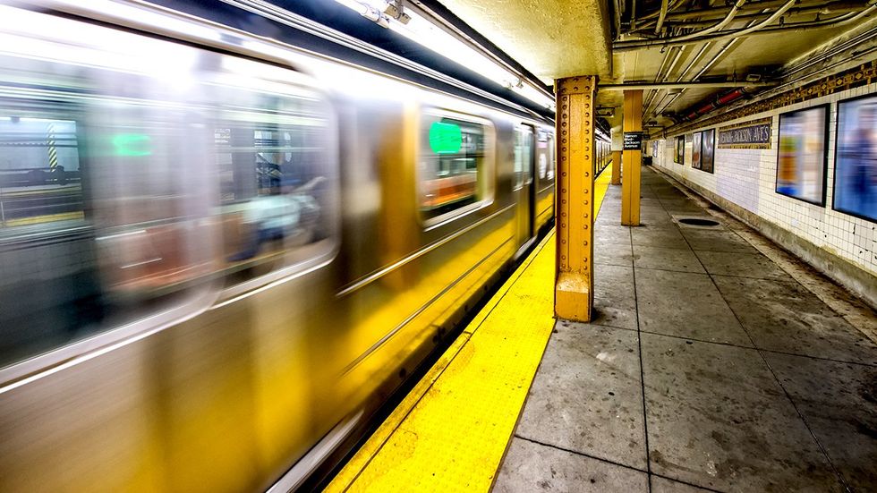New York City subway platform train speeding up