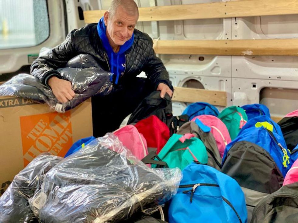 Newman helping someone living on the street