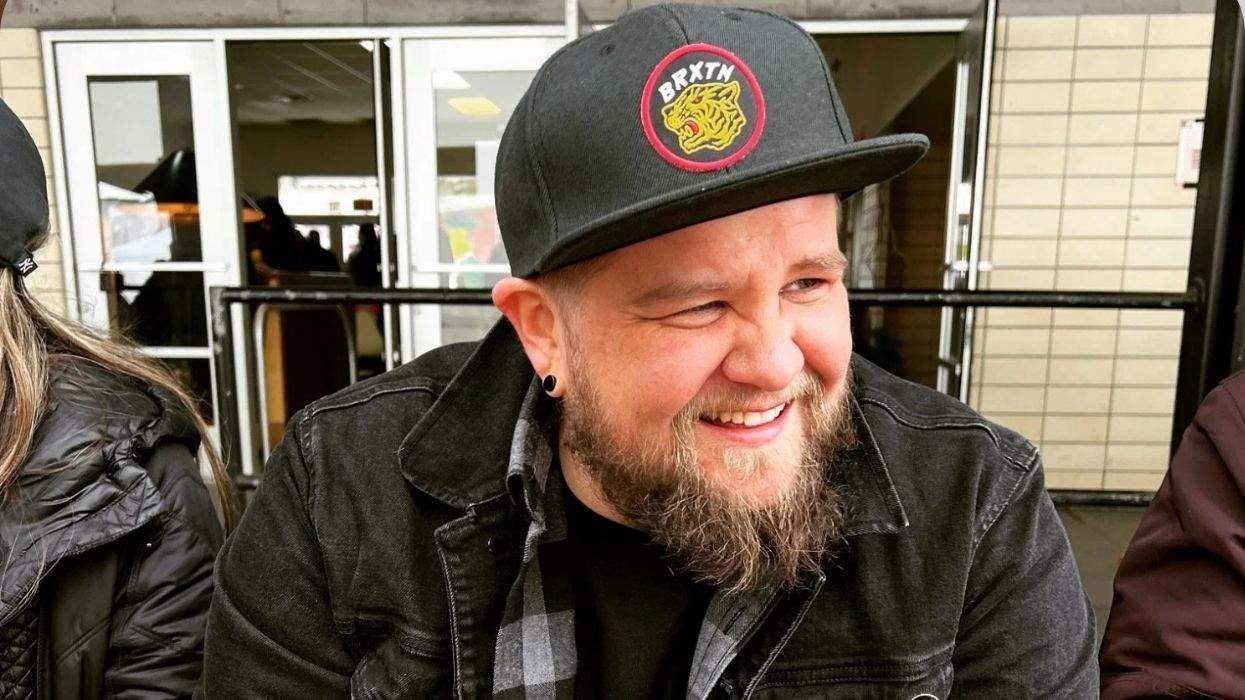 nikson Mathews wearing a hat