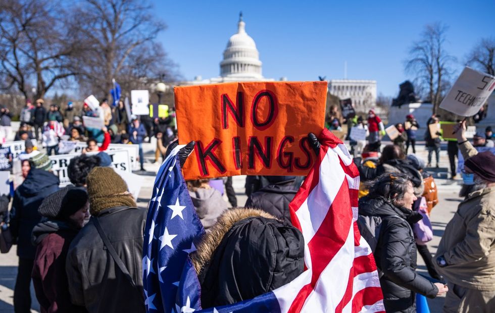 NO KINGS in america protest sign at the captiol building february 2025