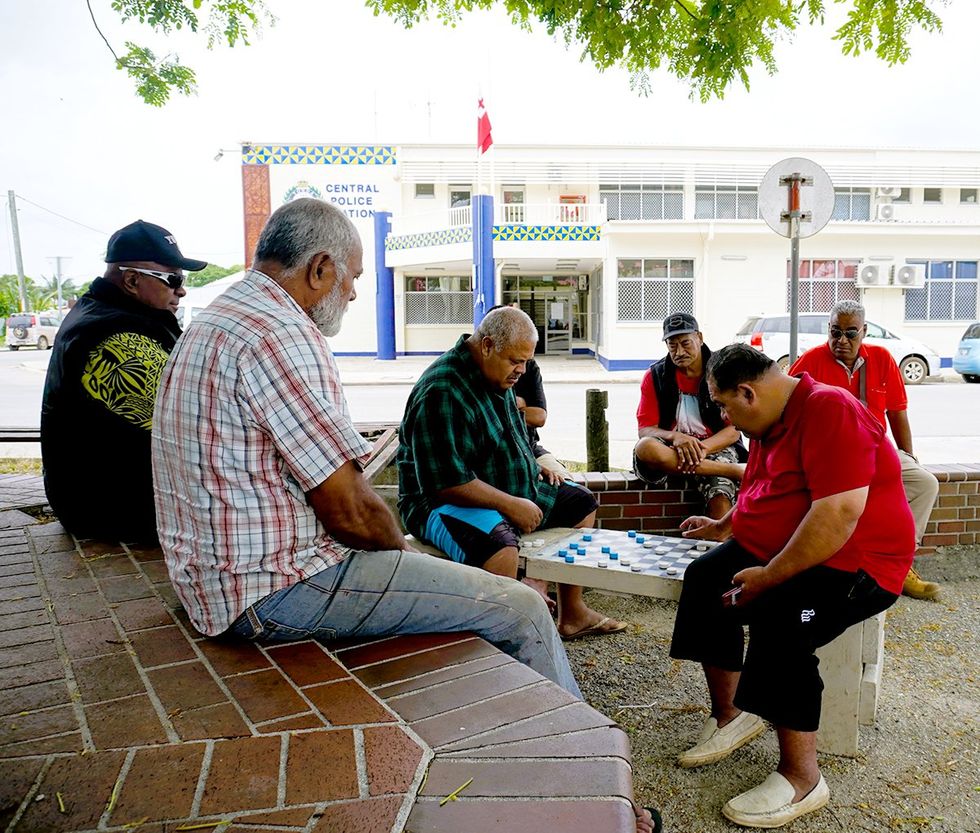 Nukualofa Tongatapu Tonga Men playing a Board Game across from the Police Station