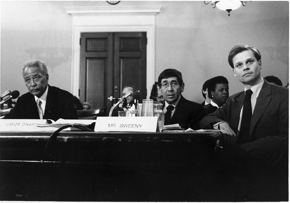 NYC Mayor David Dinkins, U.S. Rep. Ted Weiss, and GMHC executive director Tim Sweeney testify before Congress.