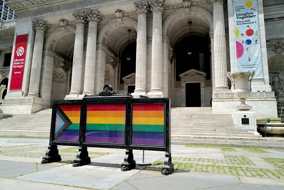 NYPL lgbtq progress pride flag sign outside new york public library