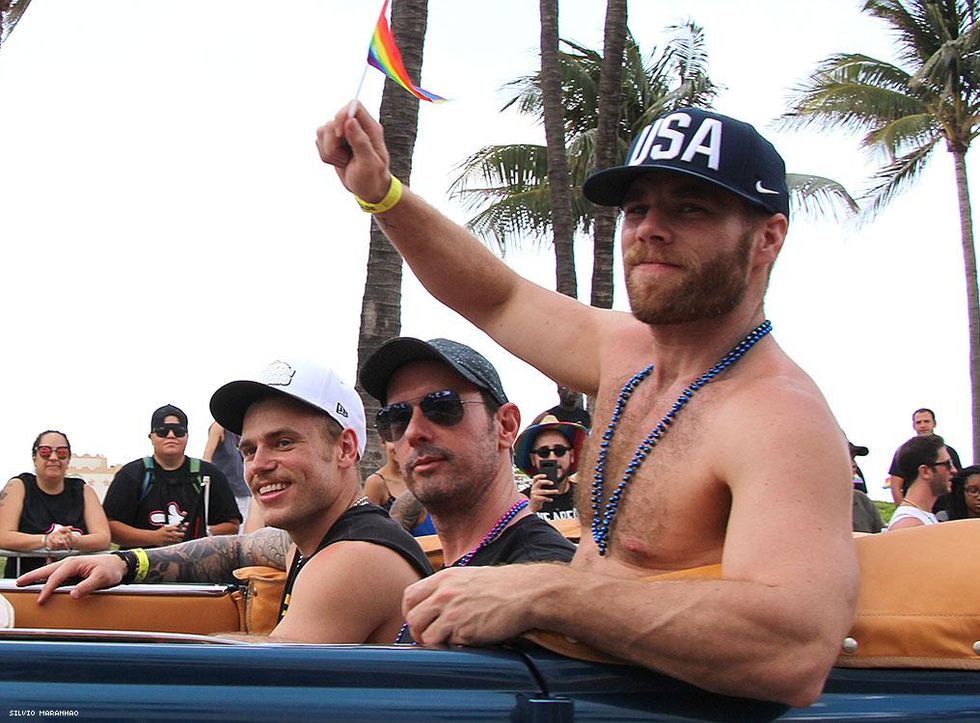 Olympic gold medalist and Pride Grand Marshal Gus Kenworthy (left) leads the parade with boyfriend Matthew Wilkas (right), and friend.