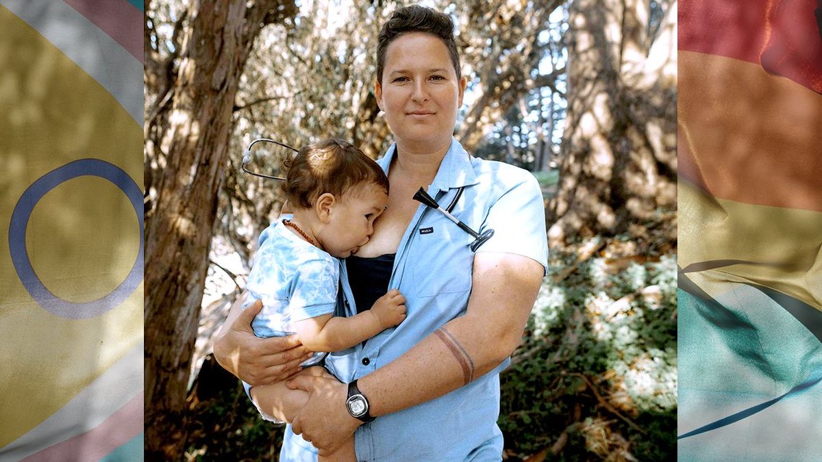 OPED Marea Goodman breastfeeding child progress pride flag in background