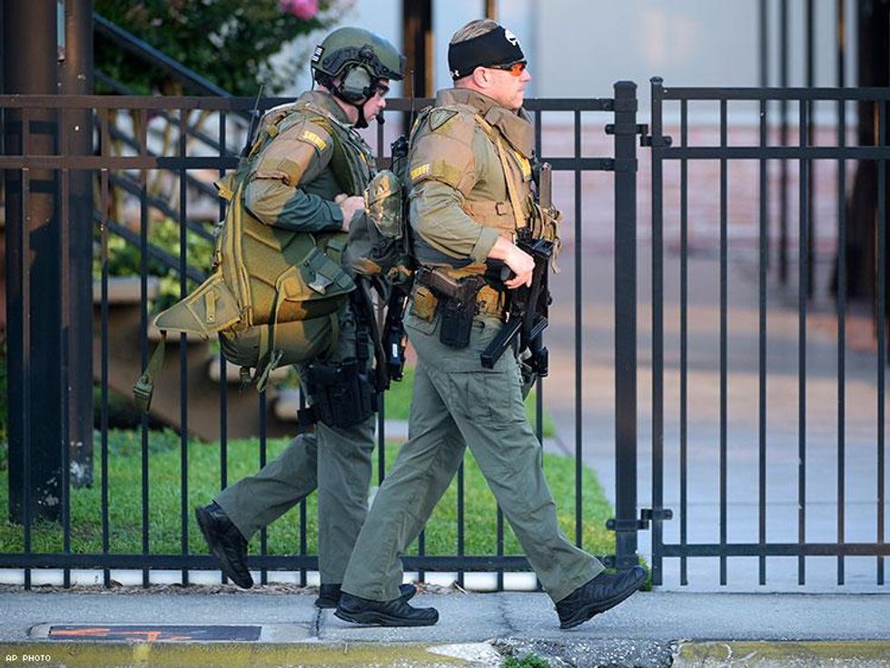 Orange County Sheriff's Department SWAT members arrive.