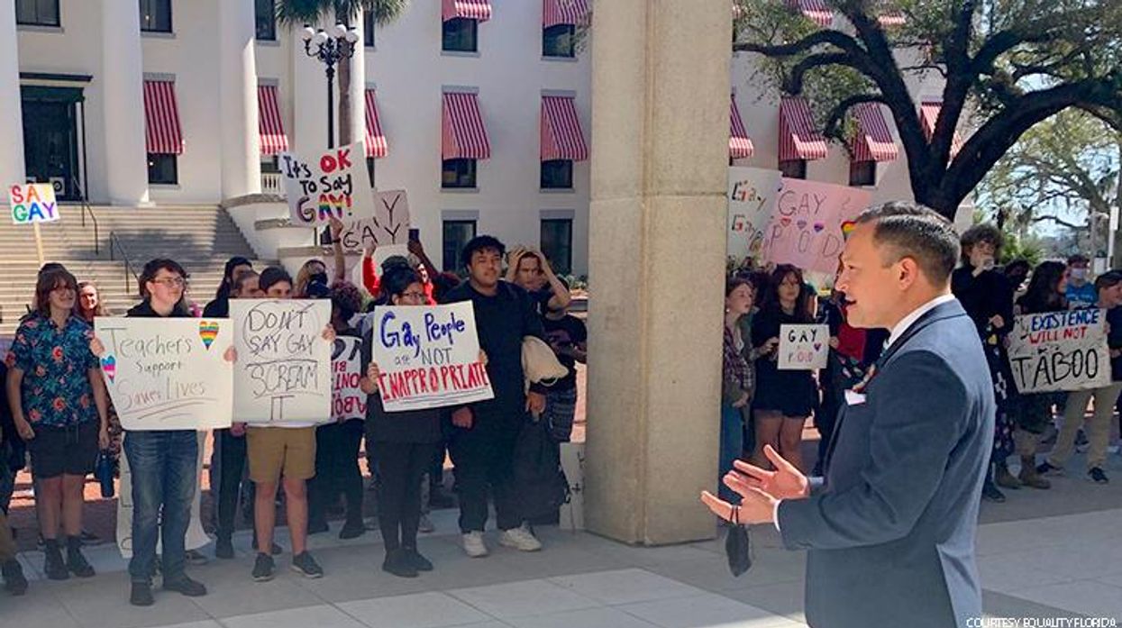Out Rep. Carlos Smith speaks to children during a walkout