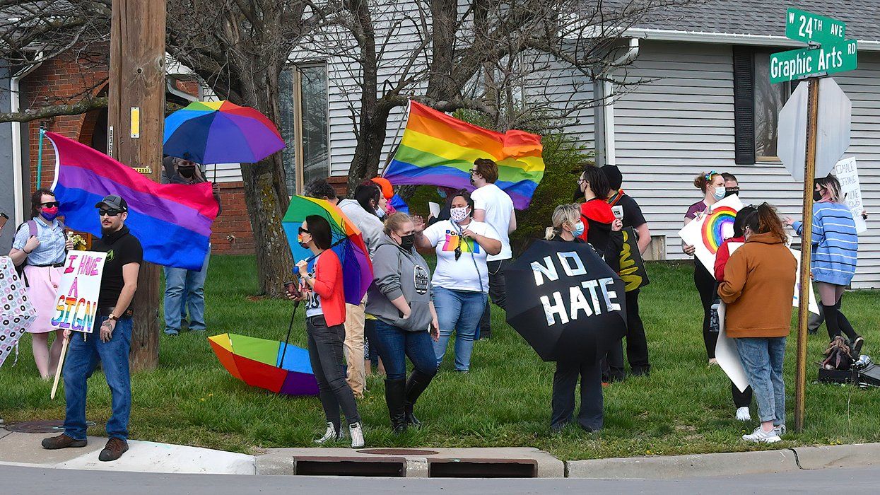 parasol patrol LGBTQIA rainbow umbrella shields counter protest Westboro Baptist Church in front of the Emporia Middle School Emporia Kansas 2021