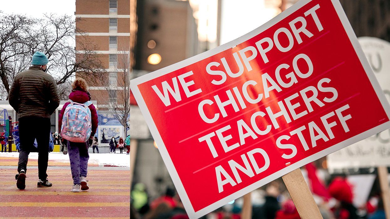 parent and child arrive for classes at Pritzker elementary school Chicago Illinois alongside Chicago Teachers Union protest sign