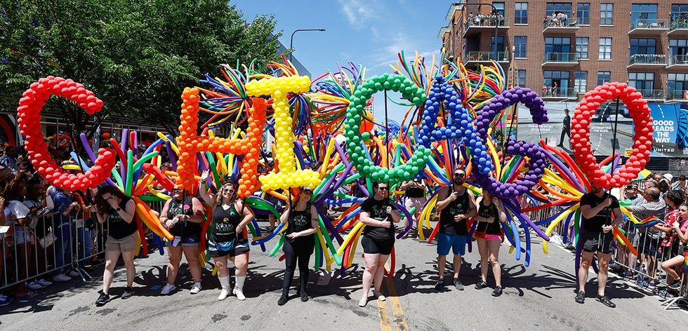 Participants carry rainbow balloons 51st LGBTQ Pride Parade Chicago Illinois